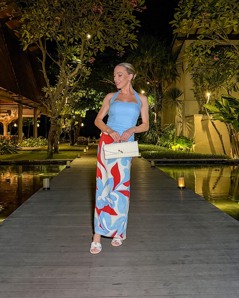 red and blue colorblocking dress worn by fashion editor eve dawes with white shoes and clutch
