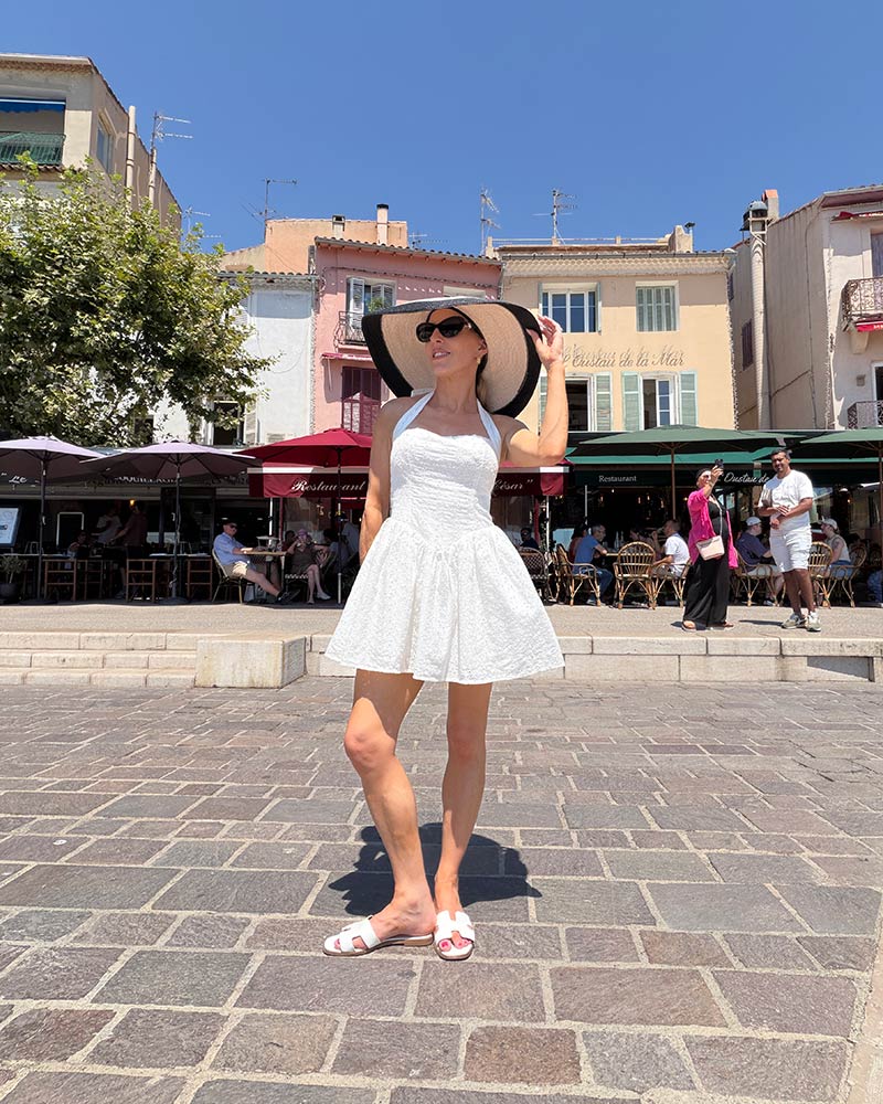 cassis france attractions harbor woman white dress