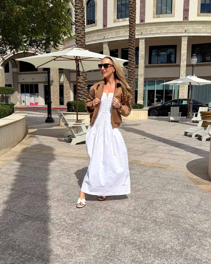 brown suede jacket womens styled with long white dress for Fall